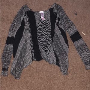 A black white and gray sweater thing